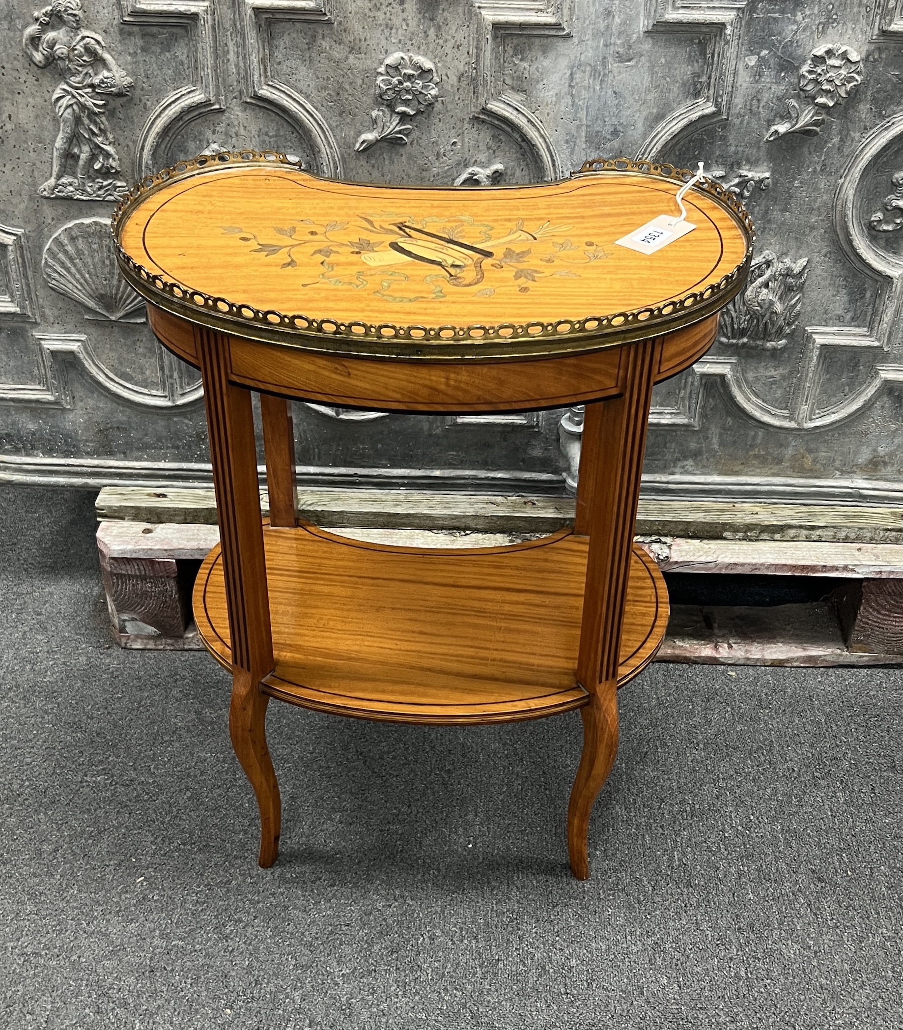 An Edwardian ormolu mounted satinwood kidney shape occasional table 53cm wide, 34cm deep, 65cm high